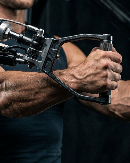 Man using resistance machine for intense arm training